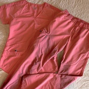 Coral athletic scrubs with pockets and bottom zip